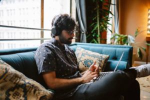 A freelancer works on a laptop at home, symbolizing the flexibility and lifestyle considerations for Dubai visas.